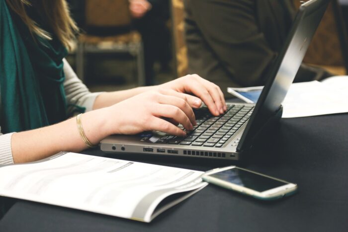 A woman working on laptop in office