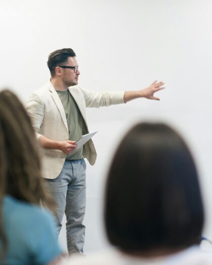 Man giving student lecture with whiteboard