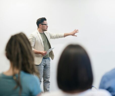 Man giving student lecture with whiteboard